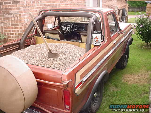 mvc007s.jpg 1 cu yd of pea gravel. (2700 lbs)
Not bad for a "1/2 ton" truck!
5150# empty w/o top and
7850# loaded.