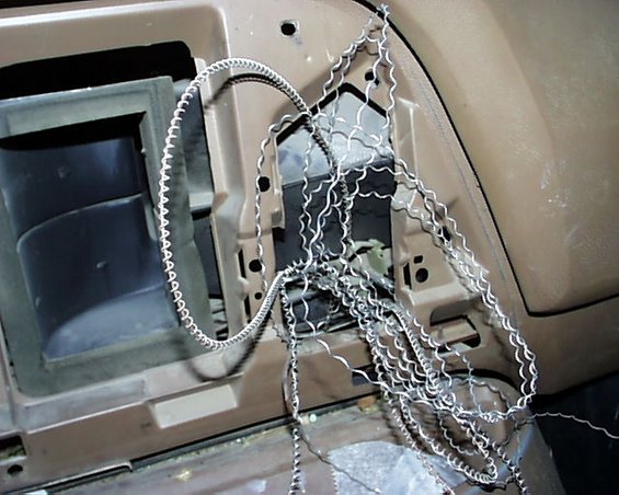 Interior dashboard with tangled wires and mesh