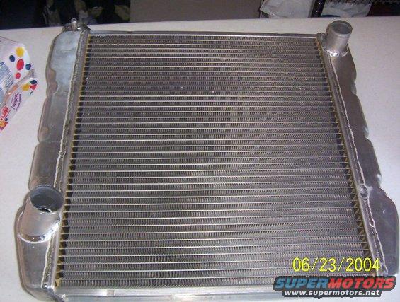 Radiator with visible date stamp 06/23/2004 and SuperMotors logo