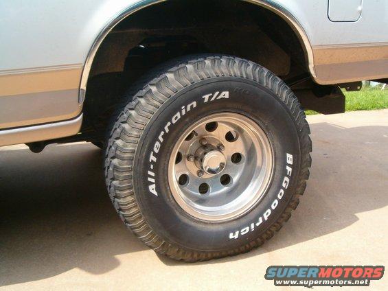 BFGoodrich All-Terrain T/A tire on a light SUV with brown stripe
