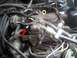 1985 Ford Bronco - A red arrow highlights a specific component on the engine's carburetor assembly.