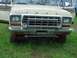 1979 Ford Bronco - This Ford truck, likely from the late 1970s, has a chrome grille guard and auxiliary lights.