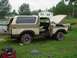 1979 Ford Bronco - A tan and brown 1978 Ford Bronco sits in a grassy yard with its hood and driver's door open.