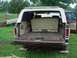 1979 Ford Bronco - This 1979 Ford Bronco is viewed from the rear with its tailgate down, revealing the cargo area and a folded-down rear seat.