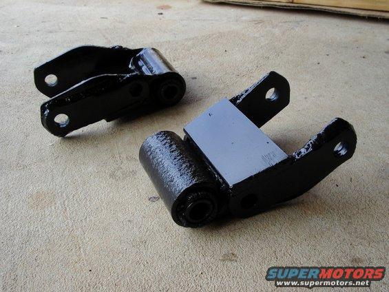 Factory shackles reinforced with trailer spring shackles on the side, and plate on the back.