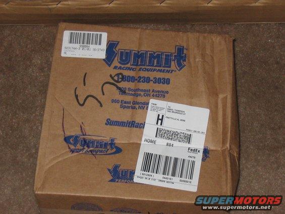Cardboard box with Summit Racing Equipment logo and FedEx shipping labels