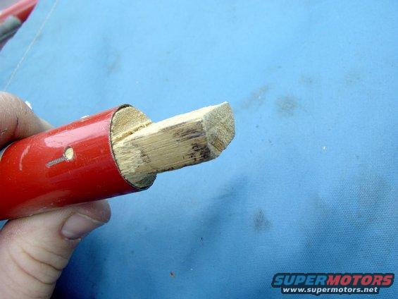 Crude but effective. Just whittled a slot out of some doweling, Cut off the ends of one of the poles and stuffed the doweling in both ends. Now you have a cross pole.