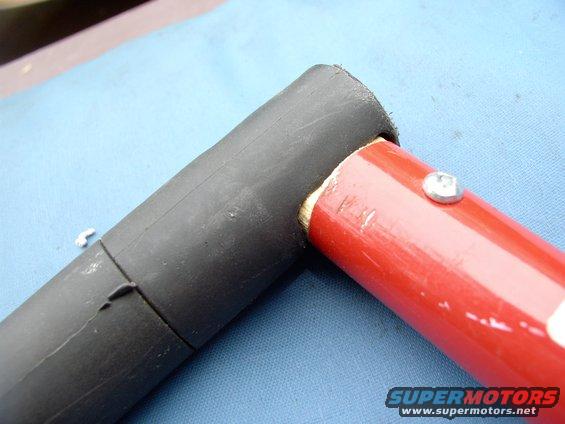 Fits into the non-screw end of the other two paint poles perfectly. Note funny Canadian square Robertson screw that the screwdriver doesn't slip out of, like a philips would.
