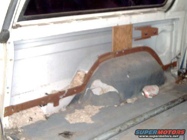 interior view of left-rear quarter panel and wheelwell