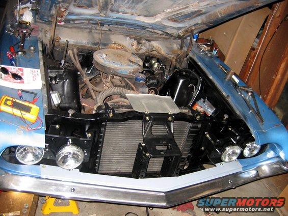 resto2.jpg Here you see the inner fender wheels and repaired radiator support. That ugly 6 has got to go (see 460).