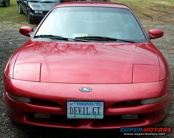 Red 1996 Ford Probe with a Virginia license plate reading DEVIL GT