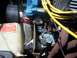 1978 Ford Mustang II - Close-up view of engine components, including a coolant reservoir and spark plug wires.