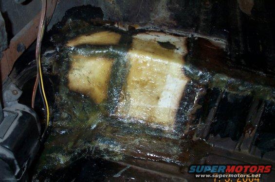 floor-013.jpg Passenger side after welded patched are covered with fiberglass and resin.