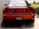 1996 Ford Probe - Rear view of a red 1996 Ford Probe, identified by its 'PROBE 24V' badging and distinctive taillight design.