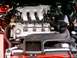1996 Ford Probe - Close-up view of a vehicle's engine bay, showing the intake manifold and spark plug wires.