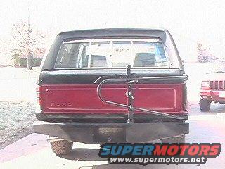 Red and black Ford Bronco rear bumper with a bike rack attached