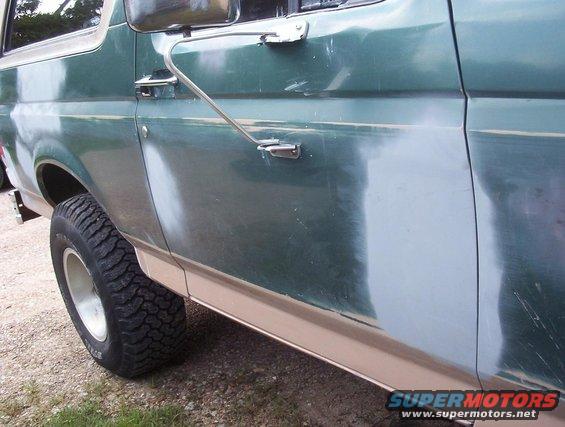 1989 Ford Bronco side panel showing primer and sanding marks before paint