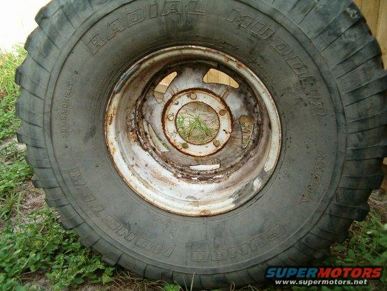 Tire and rim with "Radial Mudder" text