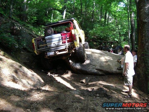 imgp0181.jpg High centered on this rock.  Had to get winched from the front and high lift the rear to get over it.