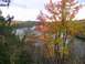 1980 Ford F-100 - Fall colors surround a tranquil lake, with pine trees in the foreground.
