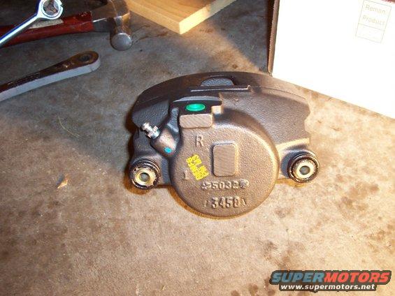 Brake caliper with 'R' marking and part numbers 5032 and 3450A stamped on it