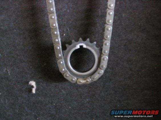 Timing chain and sprocket on dark background