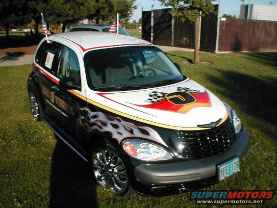 2004 Chrysler PT Cruiser with flame decals and checkered flag graphics on the hood