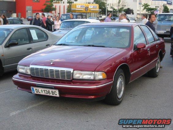 Maroon sedan with chrome grille and hood ornament. License plate DL 136 BC