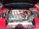 1992 Ford Probe - The engine bay of a 1992 Ford Probe, a modified engine with a turbocharger and intercooler.