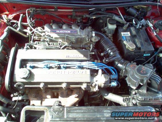Engine bay with "INJECTION" and "DOHC 16 VALVE" labels visible