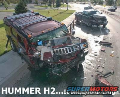 Damaged red Hummer H2 in a collision with a pickup truck