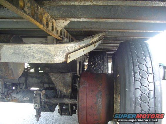 Underside view of a trailer's suspension and tires