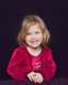 1995 Ford Bronco - A young girl with blonde hair smiles while wearing a red dress against a dark background. The Supermotors logo is visible at the bottom.