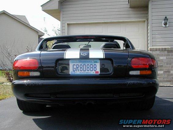 Black Dodge Viper with dual white stripes on the rear. Minnesota license plate GR8D8B8