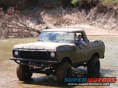 1978 Ford Bronco in water, 3q-front view, tan color