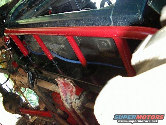 Driver side rock rail/cooling pipe