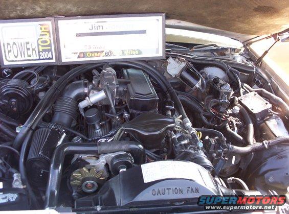 Engine bay with "POWER TOUR 2004" and "Jim Gothman Over 60 Miles" plaques