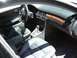 1999 Audi A6 - The interior of a 1999 Audi A6 features leather seats, wood trim accents, and a central console with an automatic shifter.