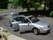 1999 Audi A6 - Silver 1999 Audi A6 sedan with doors and trunk open on a sunny day.