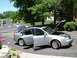 1999 Audi A6 - A silver sedan sits in a driveway with its doors and hood open, possibly undergoing maintenance.