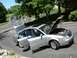 1999 Audi A6 - A silver sedan is parked on a driveway with its hood and doors open, revealing the engine and interior.