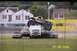 1979 Ford Bronco - A monster truck is shown crushing several cars in an outdoor arena.