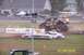 1979 Ford Bronco - A monster truck event features a Bigfoot truck airborne over demolished vehicles.