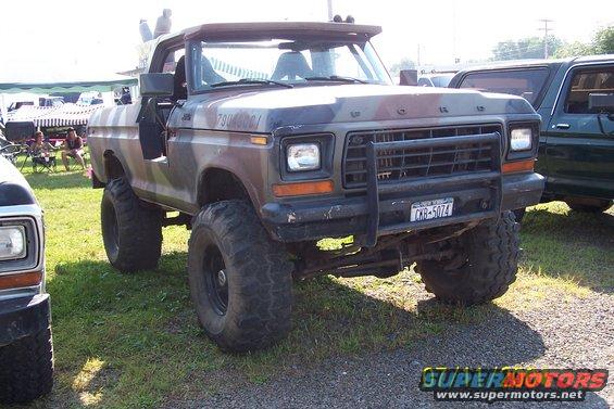Camouflaged Ford Bronco with lifted suspension and large tires