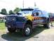 1994 Ford Bronco - This heavily modified Ford F-350 dually features custom flame paint and dual hood scoops.
