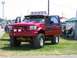1994 Ford Bronco - This heavily modified truck features custom paint, off-road lights, and a lifted suspension.