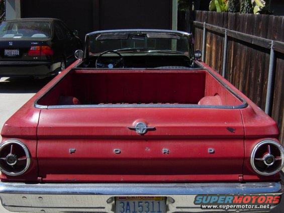 Red 1965 Ford Ranchero convertible pickup truck rear view with Ford badging