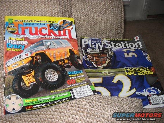 Two magazines, one about trucks and the other PlayStation, lie on a textured couch