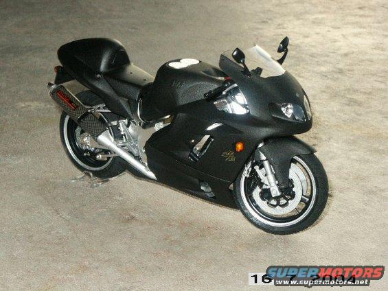 Black sport motorcycle parked on concrete floor