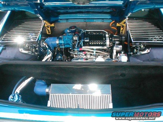 1986 Pontiac Fiero engine bay with supercharger and intercooler